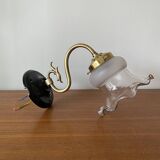 Swan neck wall light in brass with glass tulip.