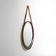 Round wall mirror with leather strap, 1960s