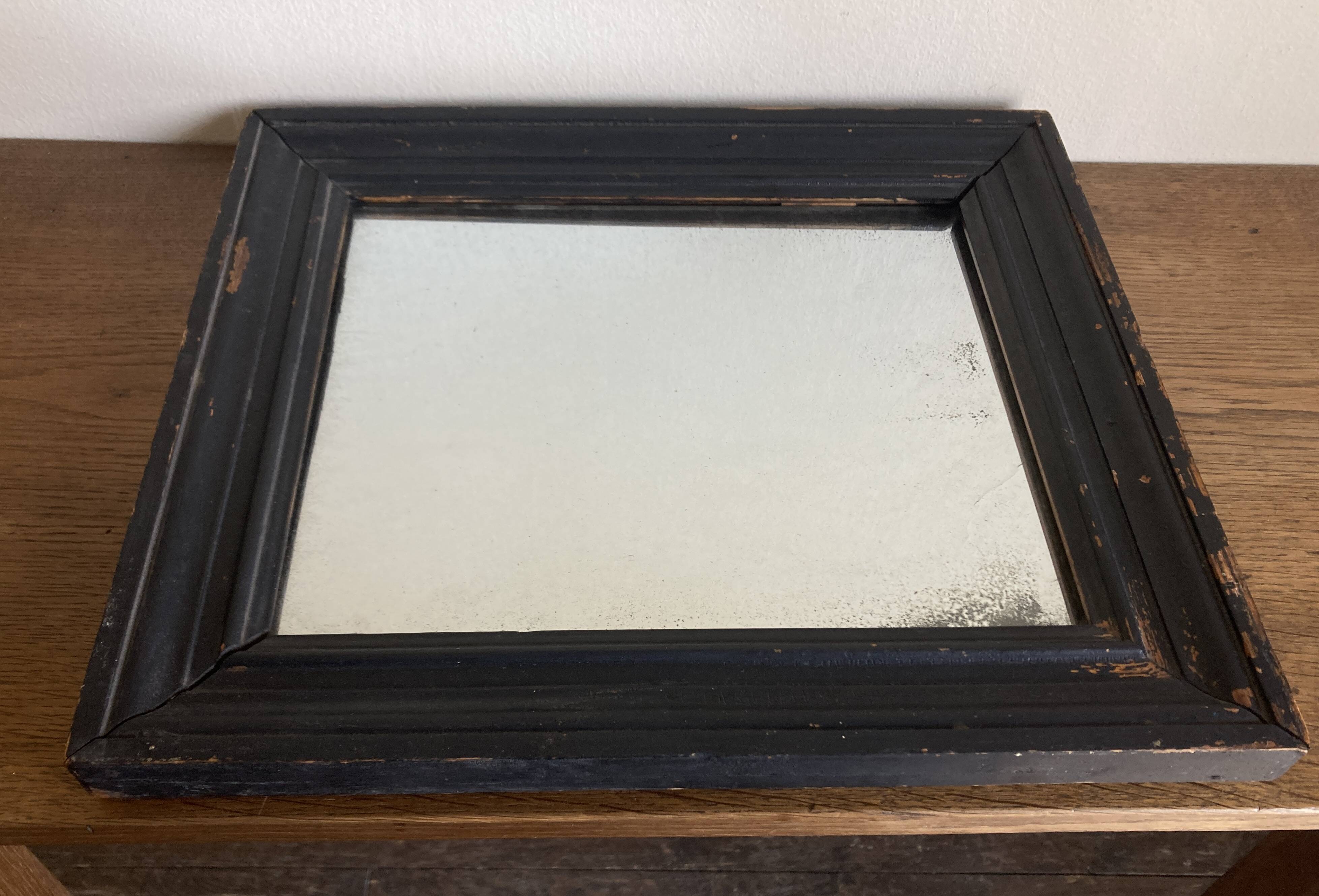 19th century blackened mirror with pitted glass 34cm x 40cm