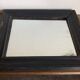 19th century blackened mirror with pitted glass 34cm x 40cm