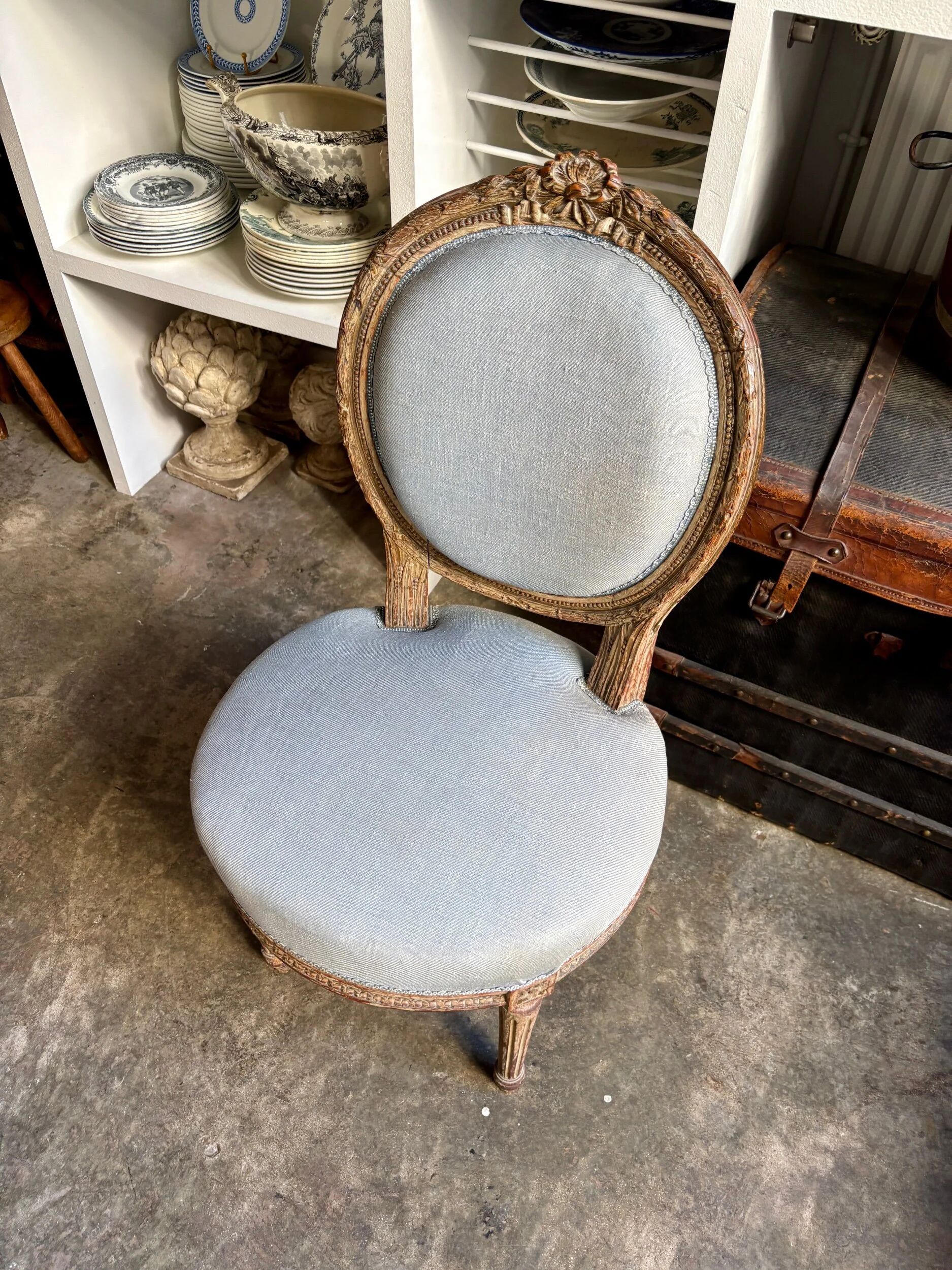 Medallion back chair in reclaimed wood and blue cotton.