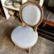 Medallion back chair in reclaimed wood and blue cotton.