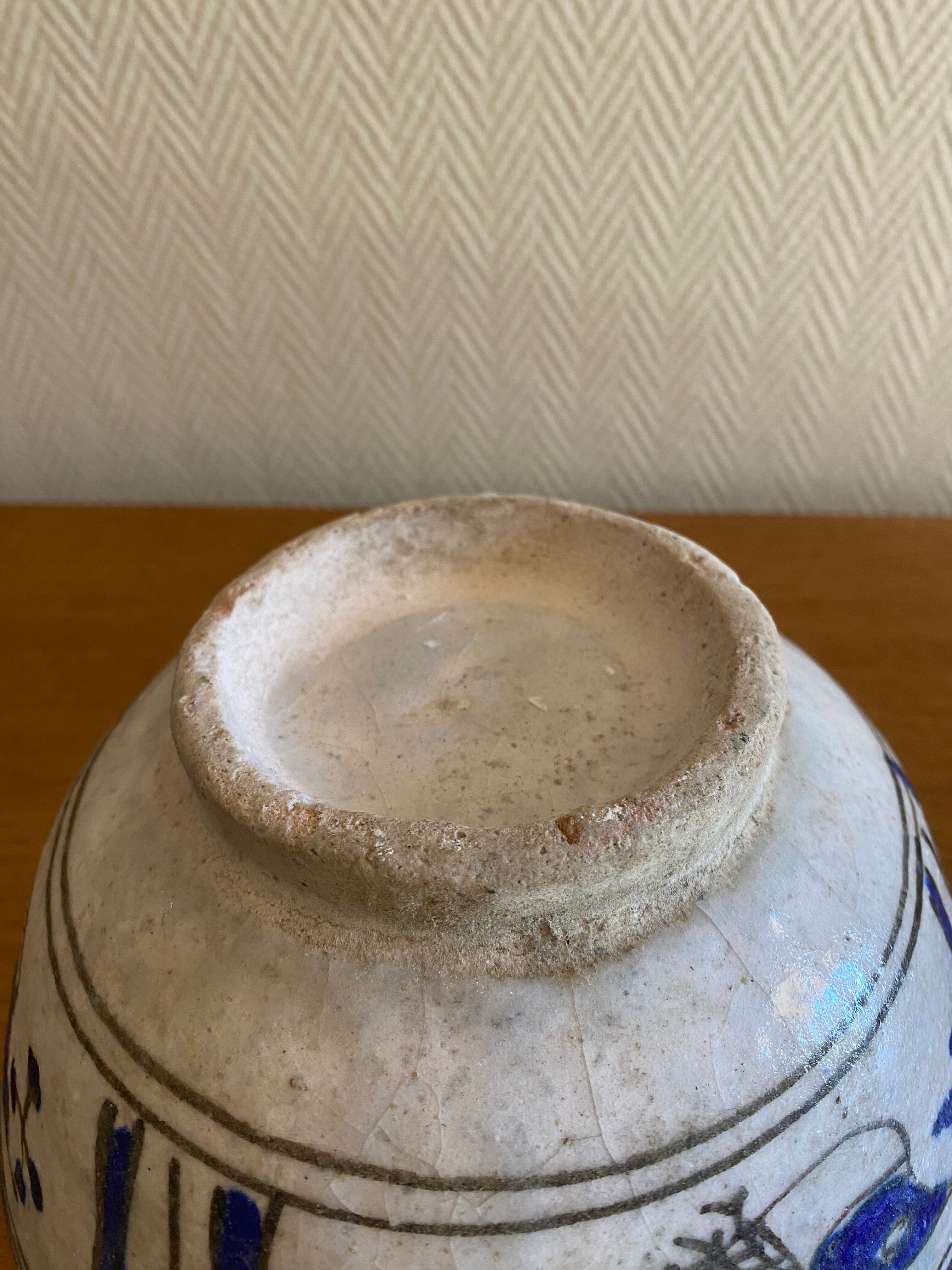 Ancient Persian ceramic bowl in Qajar style.