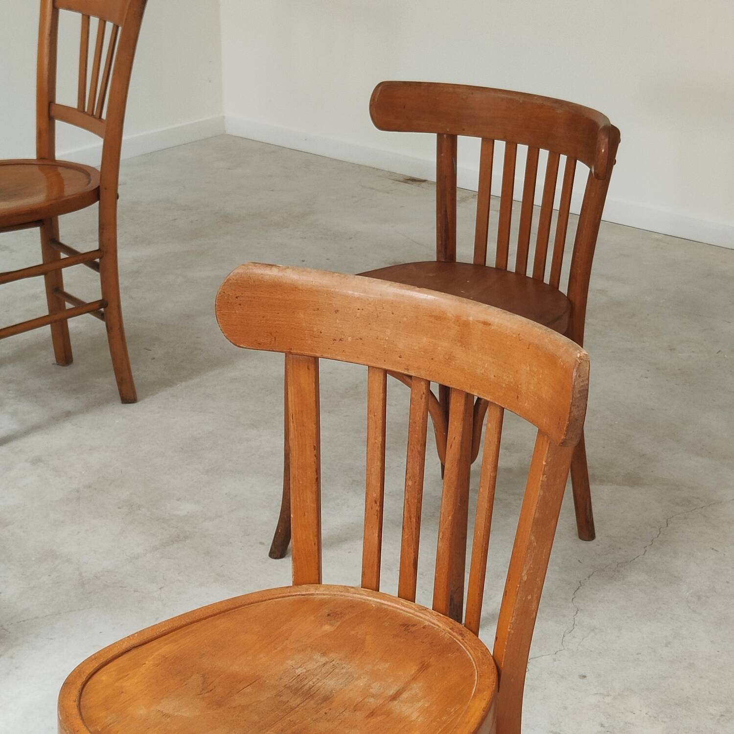 Set of 6 mismatched blond wood bistro chairs