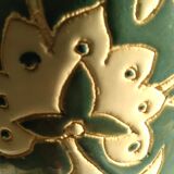 Blue water vase with white floral pattern