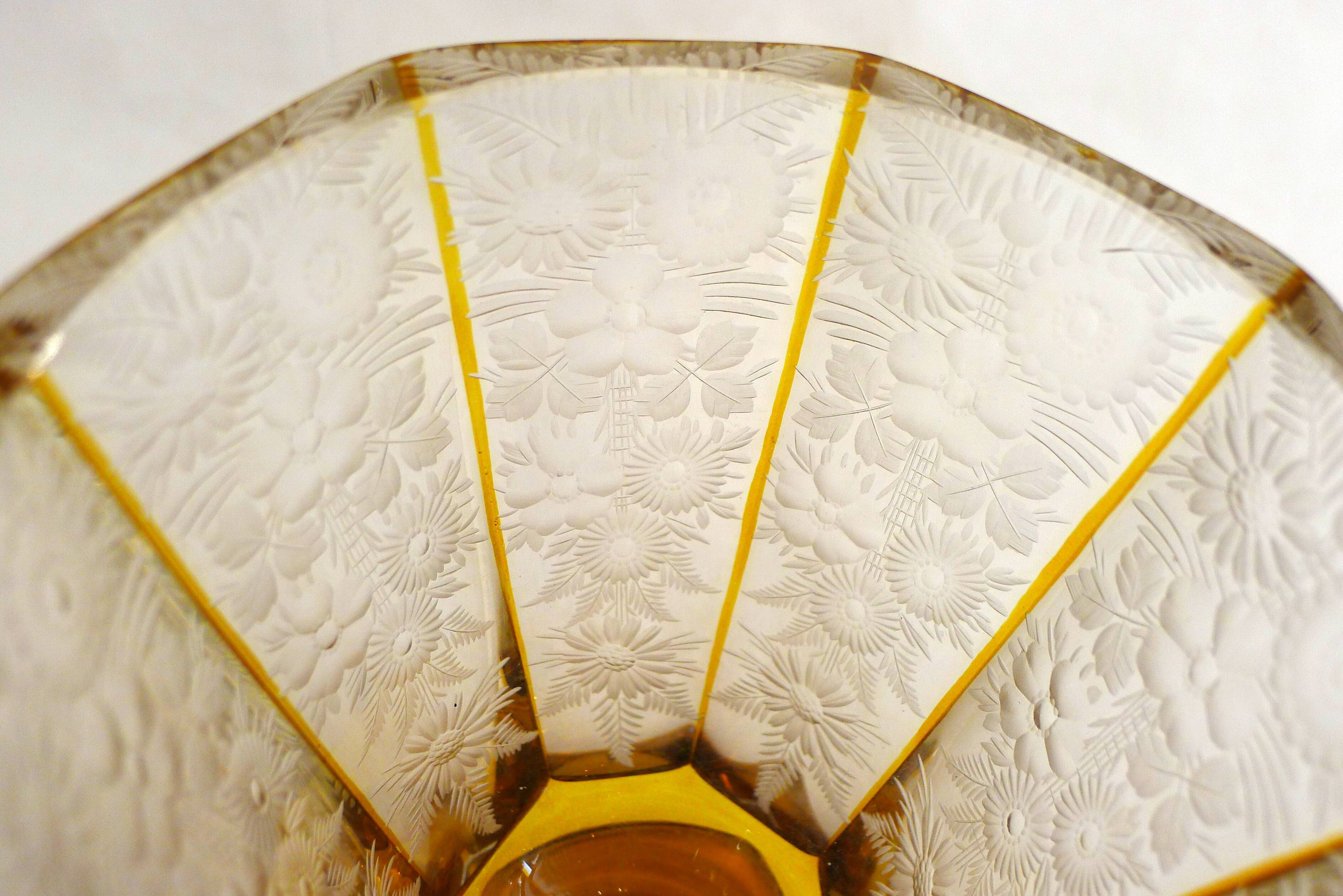 Art Deco vase engraved with flowers, faceted body on a pedestal.