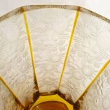 Art Deco vase engraved with flowers, faceted body on a pedestal.