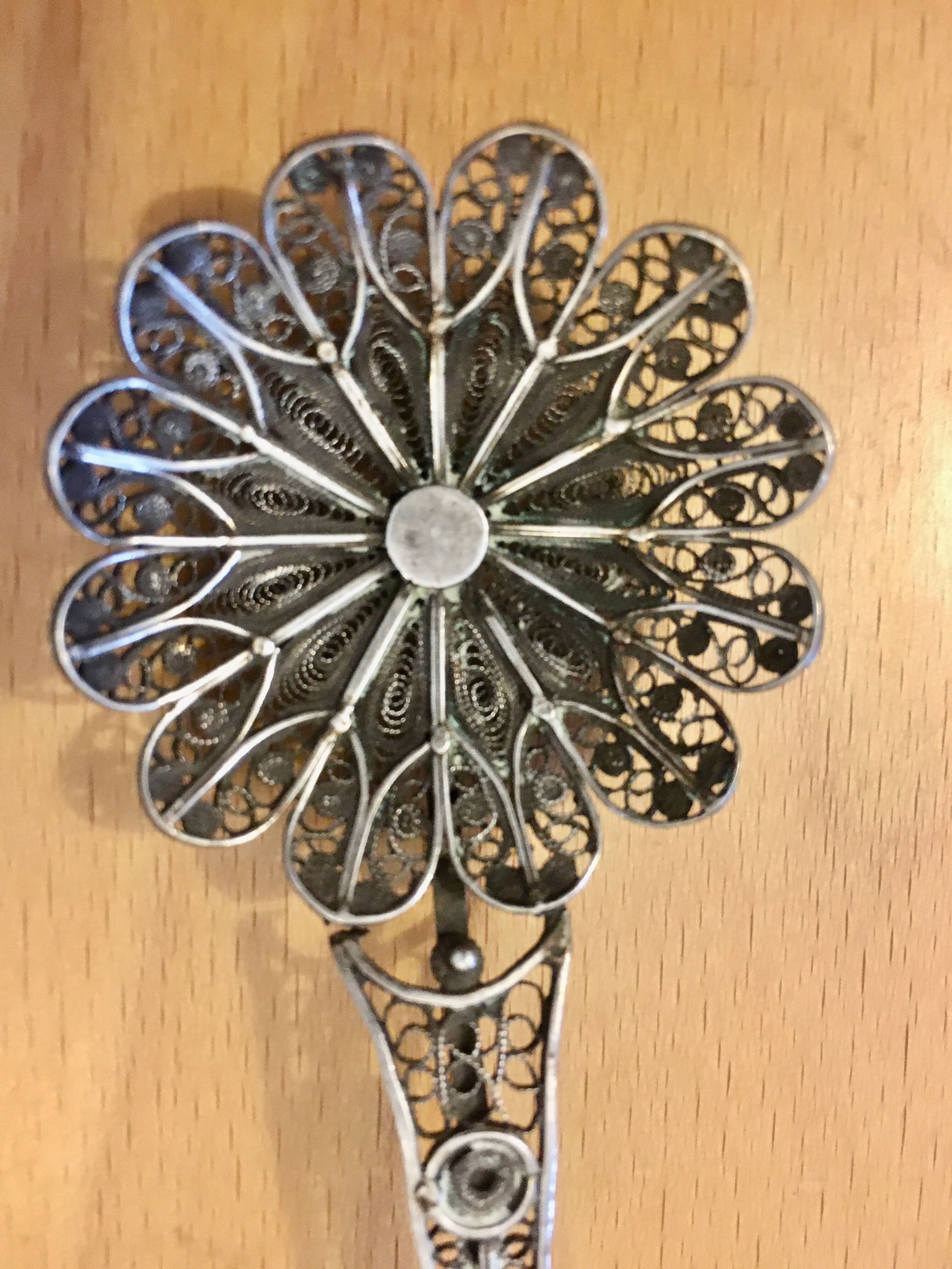 silver sprinkler spoon