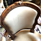 Louis XV period armchair in natural wood with convertible back carved with flowers