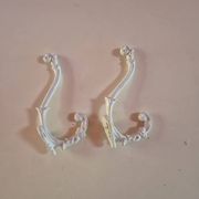 set of 2 vintage white cast iron hooks, small paint chips from the year