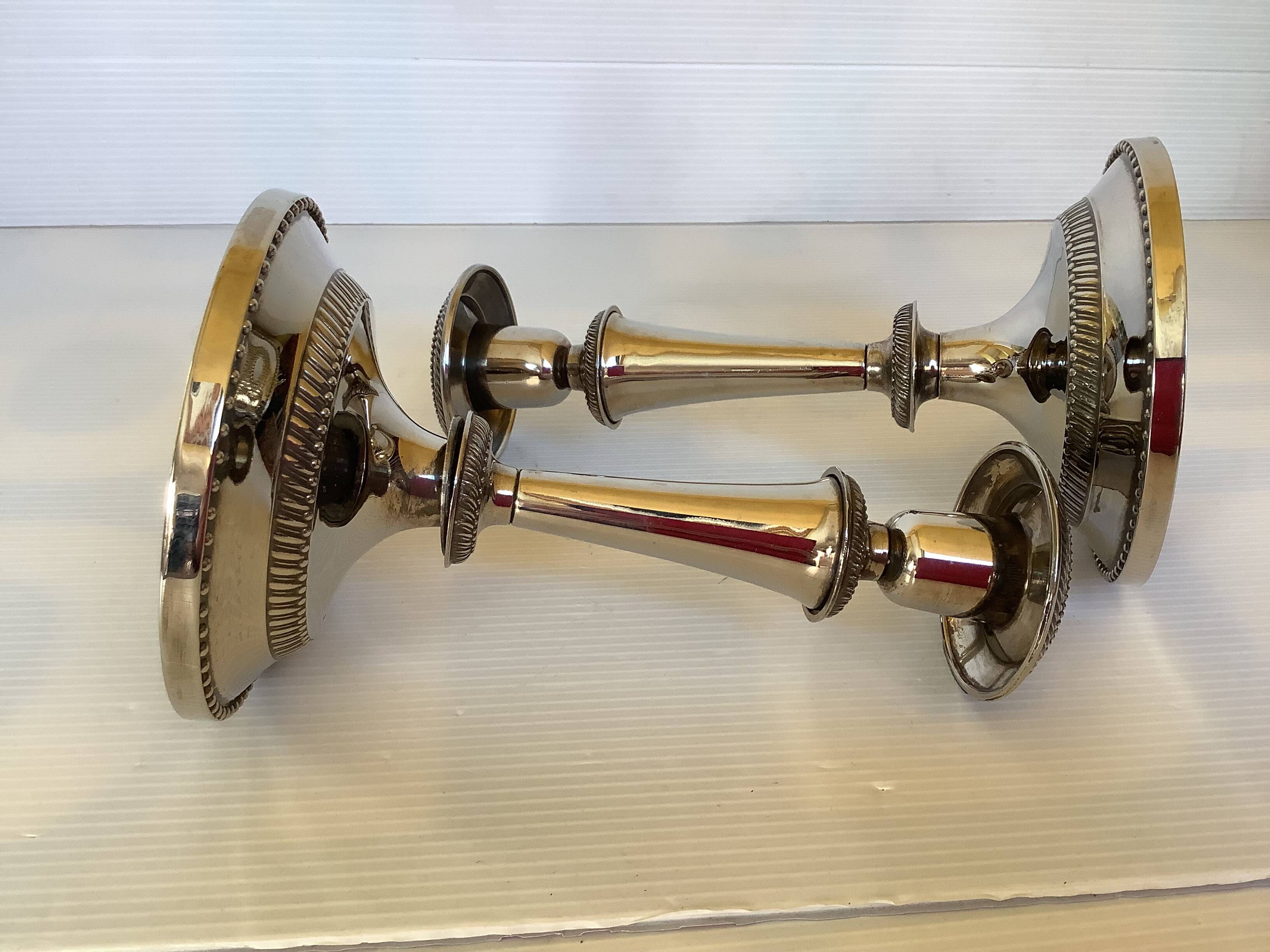Pair of silver-plated zinc metal candlesticks