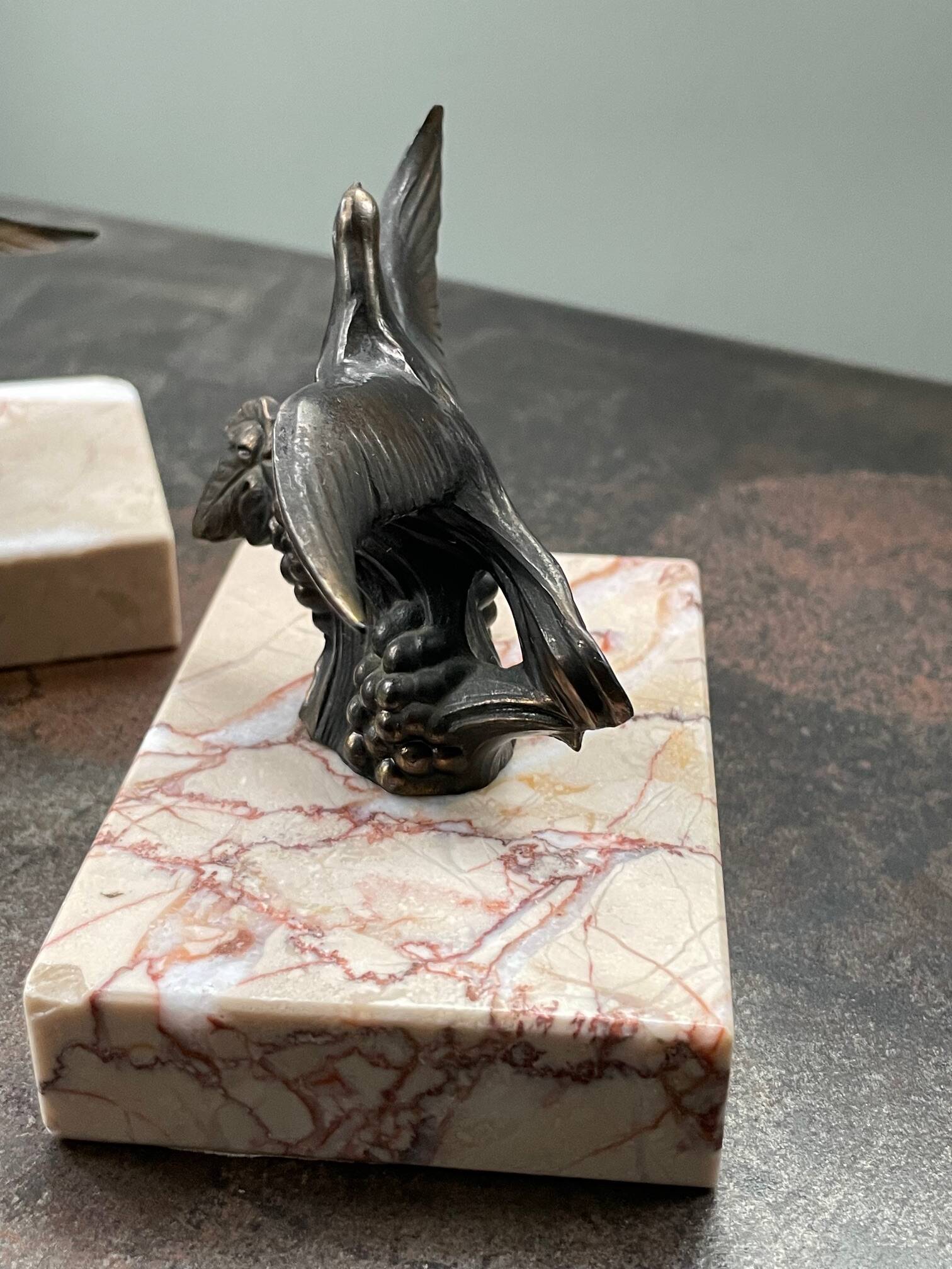 Pair of marble bookends with bronze birds