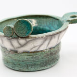 Atypical cup in turquoise and gray raku with signature