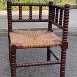 19th-century turned wooden corner chair with rush seating.