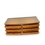 Veneered burl walnut chest of drawers with light warm brown glass top