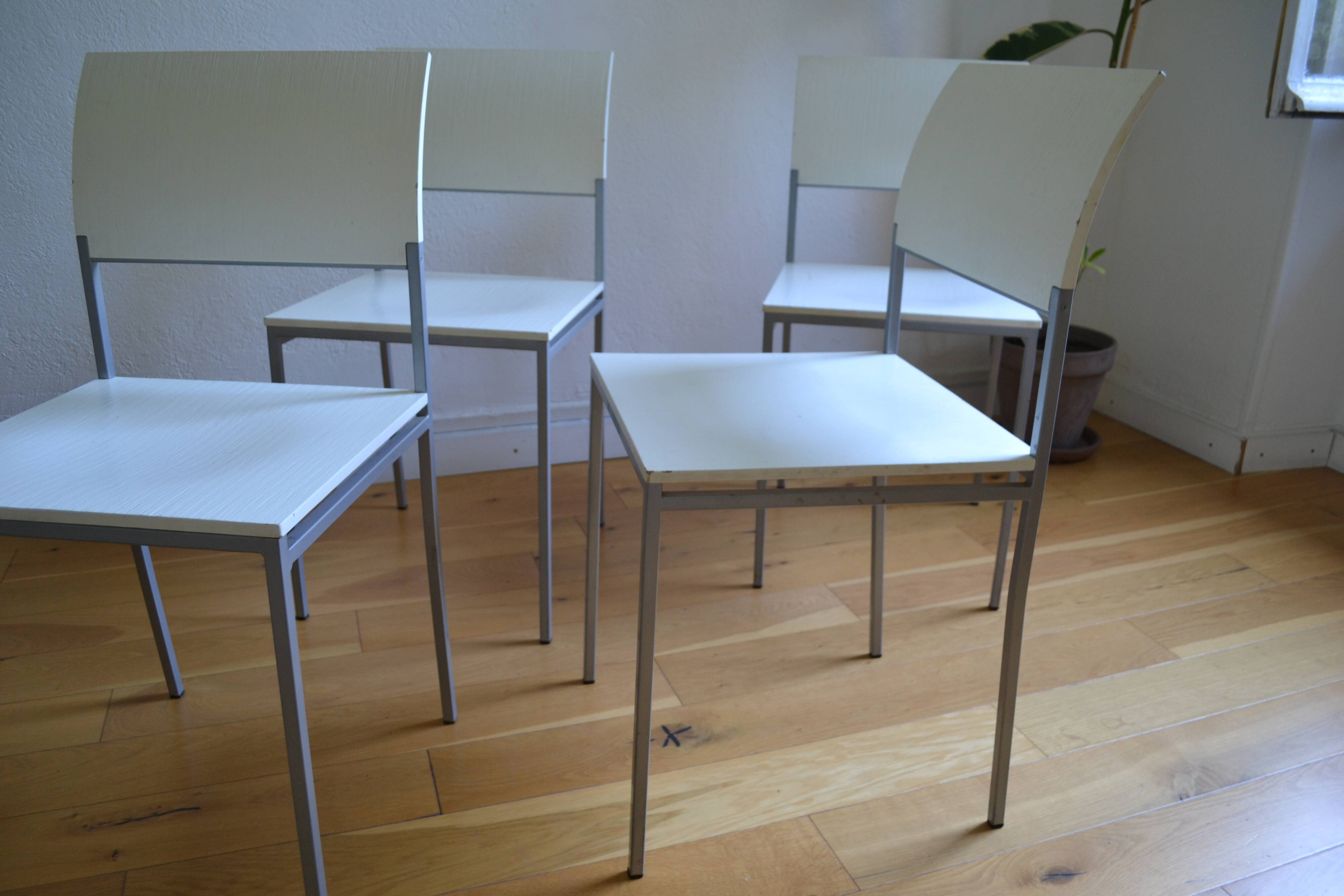 Set of 4 vintage metal and wood chairs from the 1990s.
