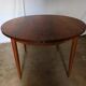 Round rosewood table with extension from the 70s
