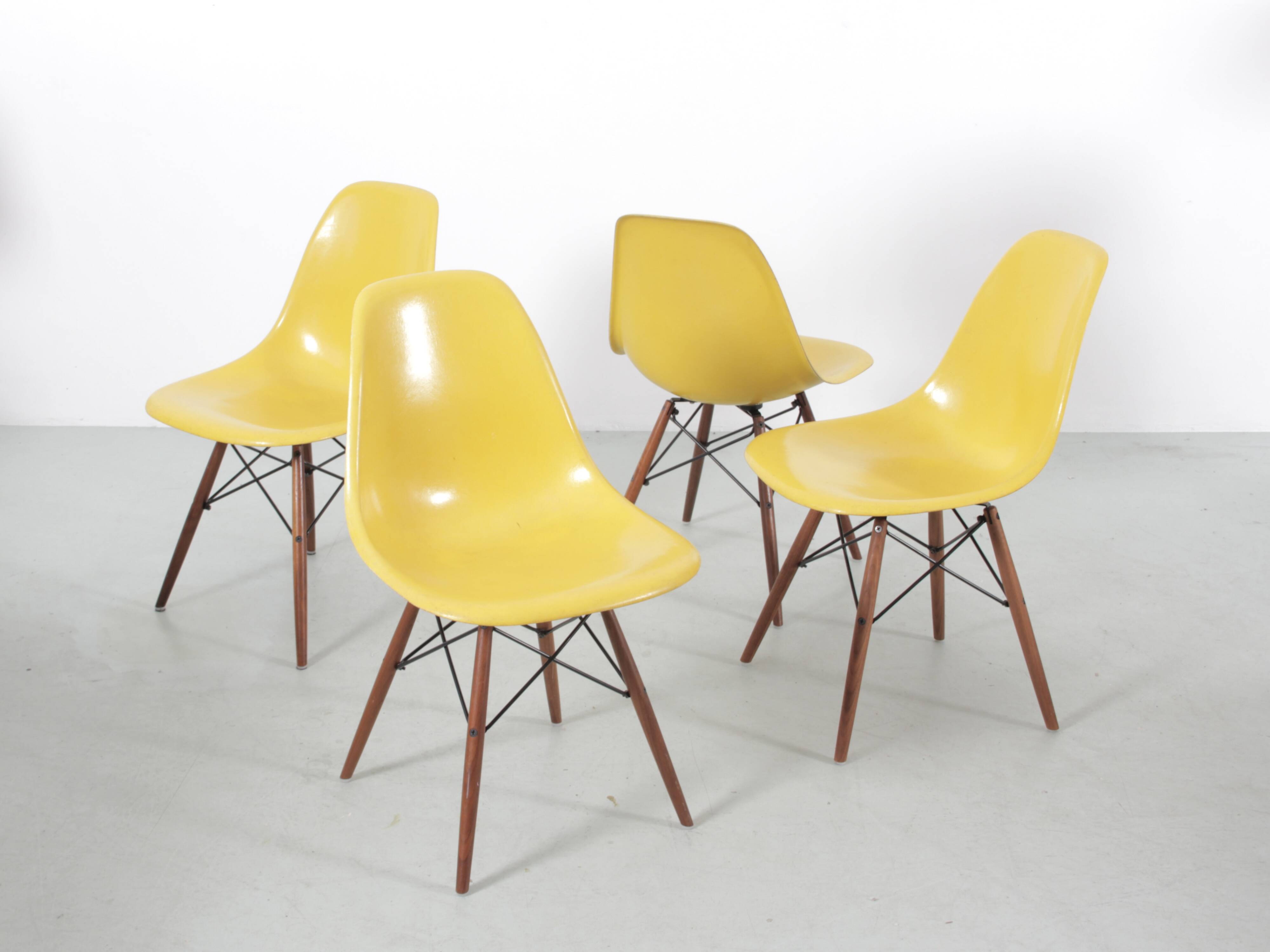 Set of 4 DSW chairs by Charles Eames - yellow fibreglass edition by Herman.