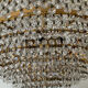 Chandelier cascade of tassels and brass