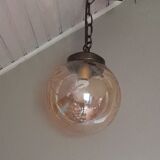 Vintage globe suspension in amber glass, chiseled floral decoration - 80s