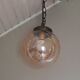 Vintage globe suspension in amber glass, chiseled floral decoration - 80s