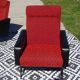 Vintage armchairs in red and black faux leather, the pair.