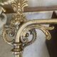 Adjustable wall light in brass and gold metal.