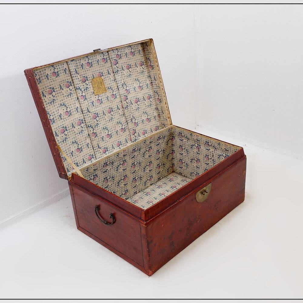Chinese red lacquered leather trunk from the early 20th century.