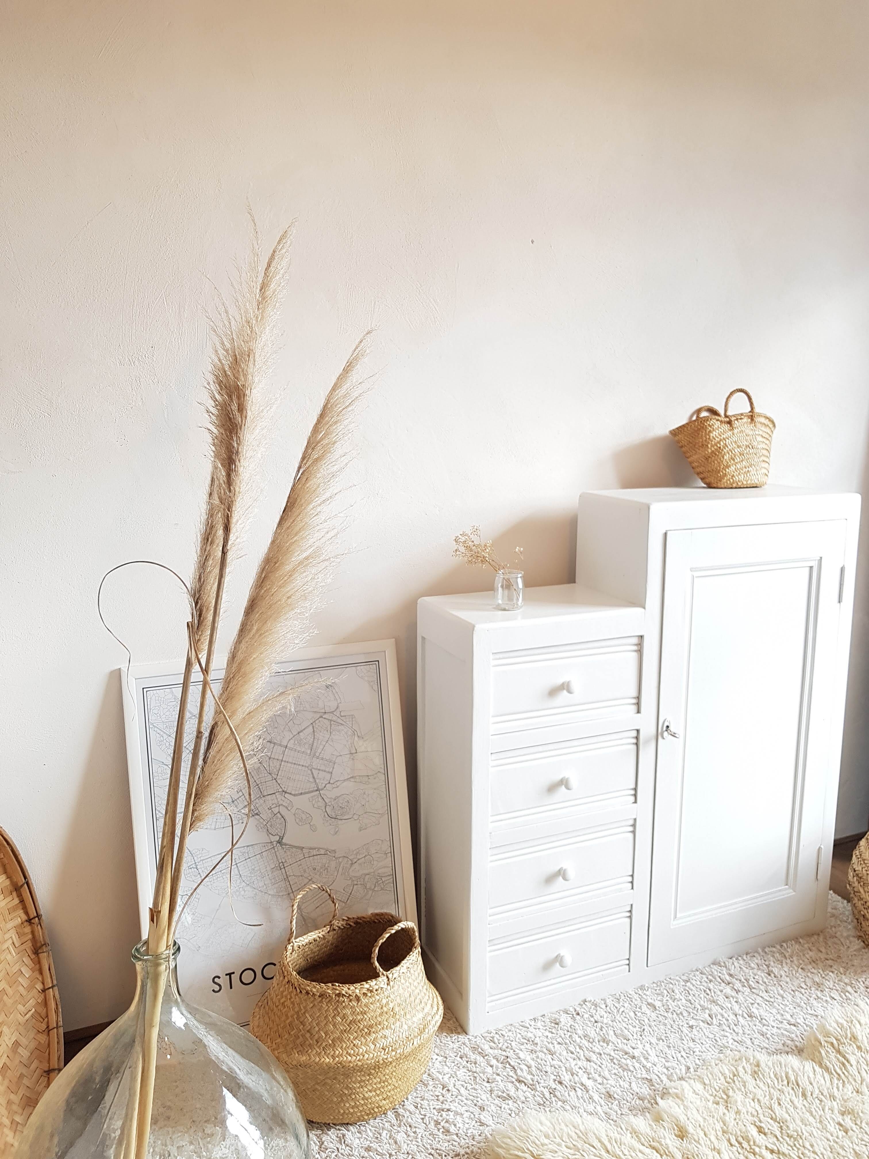 Old white asymmetrical chest of drawers