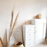 Old white asymmetrical chest of drawers