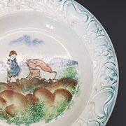 Large antique hollow dish from the 19th century, earthenware with pastoral decoration featuring a child, pig, and goose.