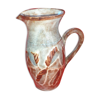 Pitcher in varnished snarl, grey-blue background. Signed.