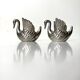 Duo candle holders in metal swan pattern
