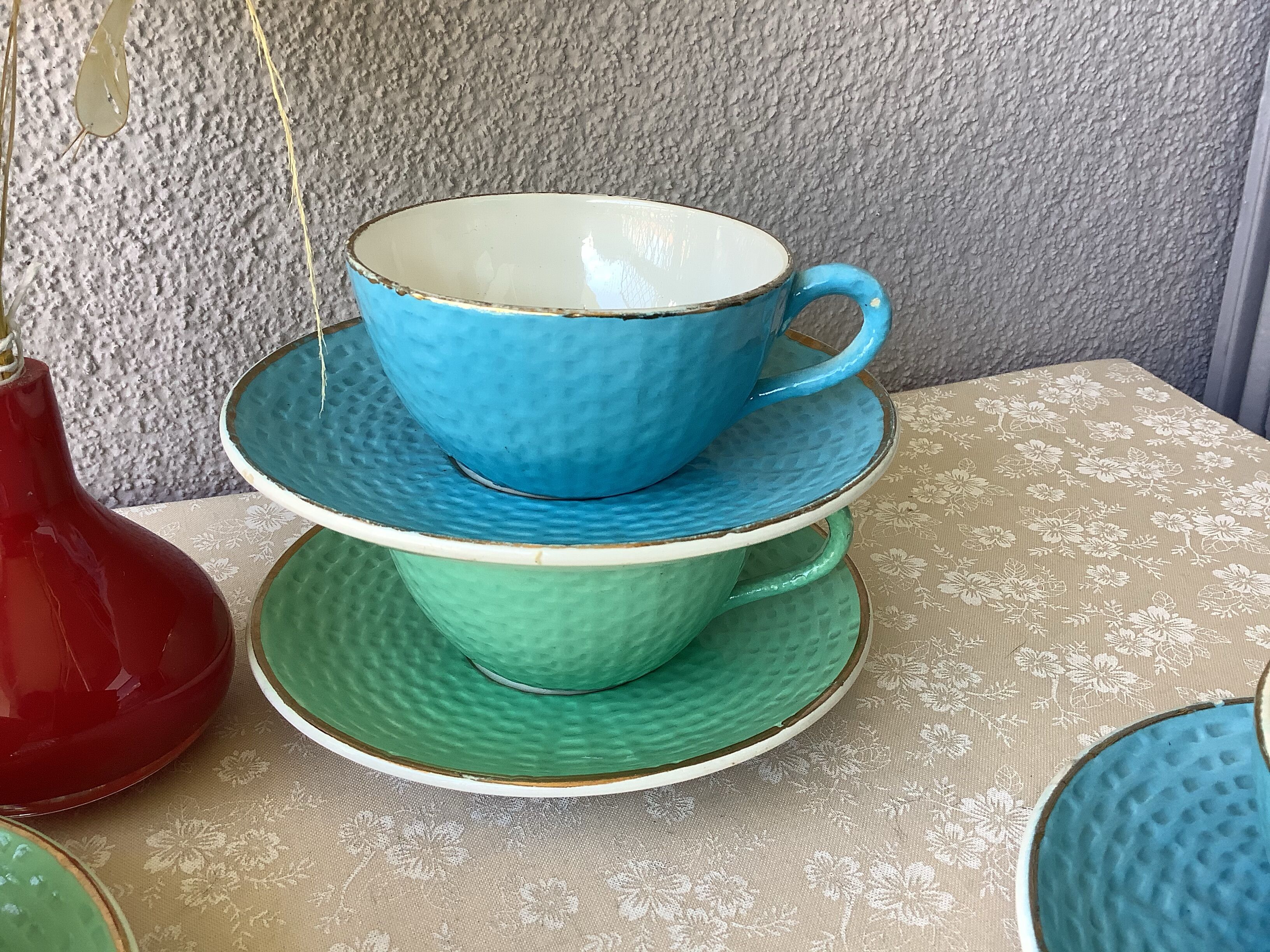Multicolored Digoin cups looking basket weaving