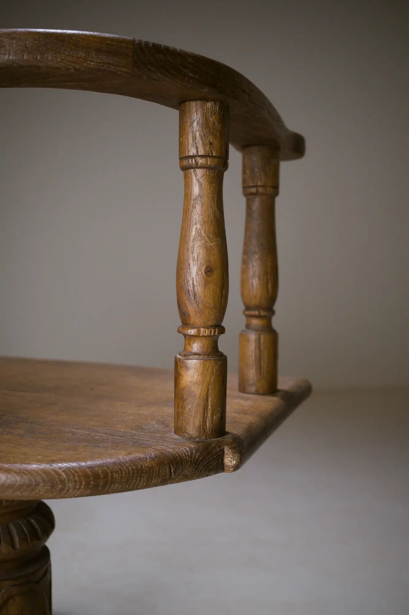Swivel armchair in carved oak with ball bearings, early 20th century.