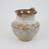 Glazed ceramic jug with plant decoration