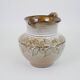 Glazed ceramic jug with plant decoration