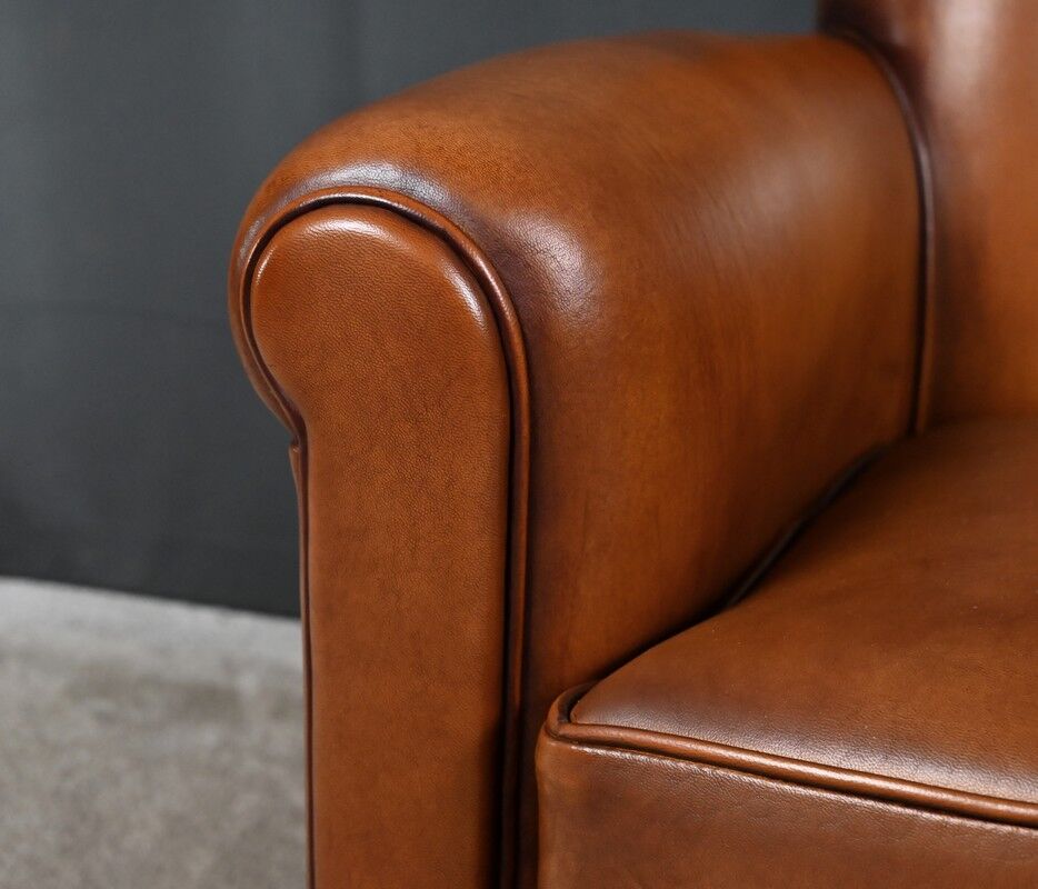 Paire de fauteuils club en cuir