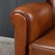 Paire de fauteuils club en cuir