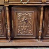 Important two-body buffet in solid walnut, richly carved in pure Renaissance style.