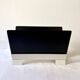 Black and cream metal magazine rack, 1950s.