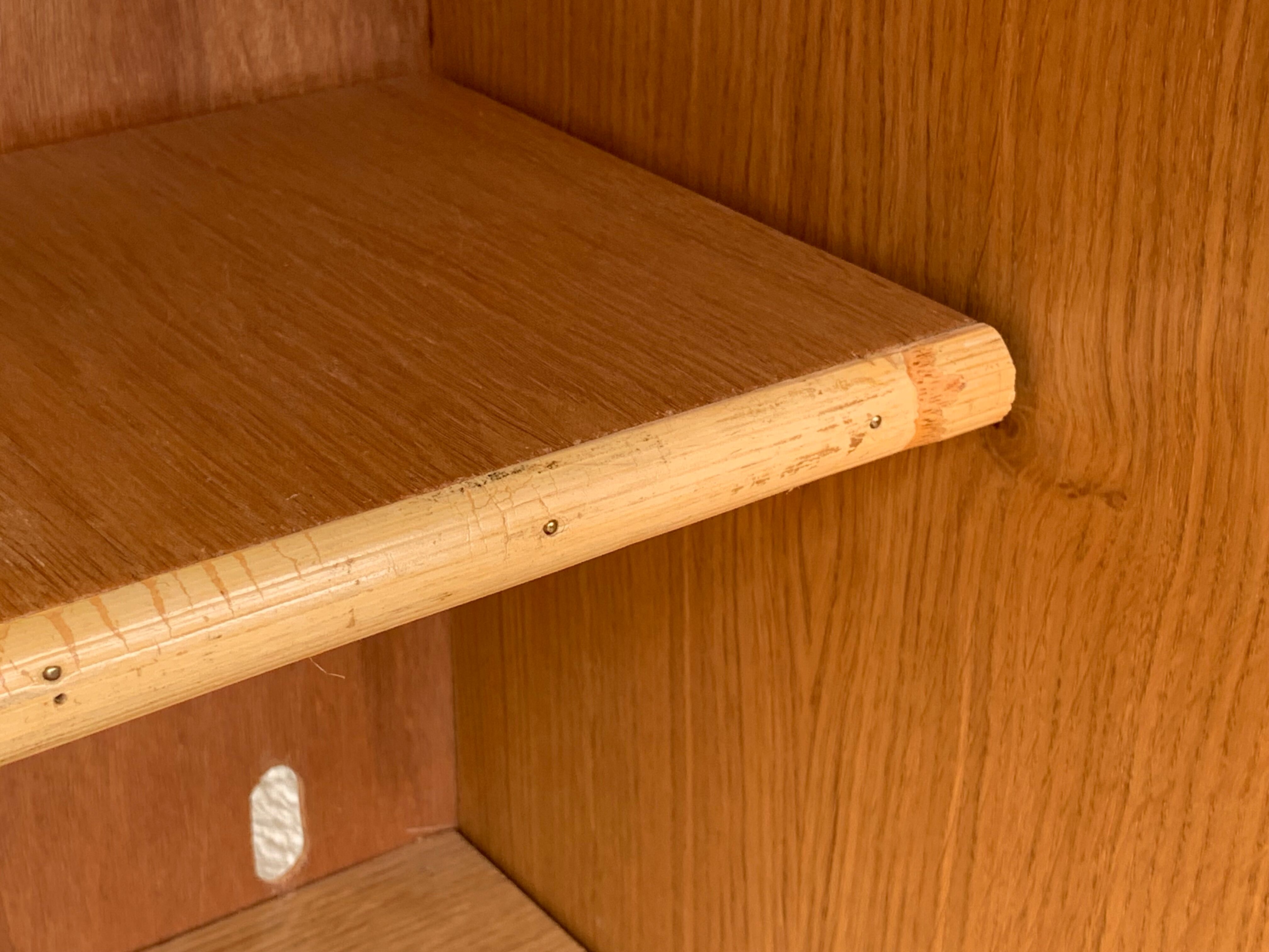 Rattan wardrobe with tapered legs from the 1960s.