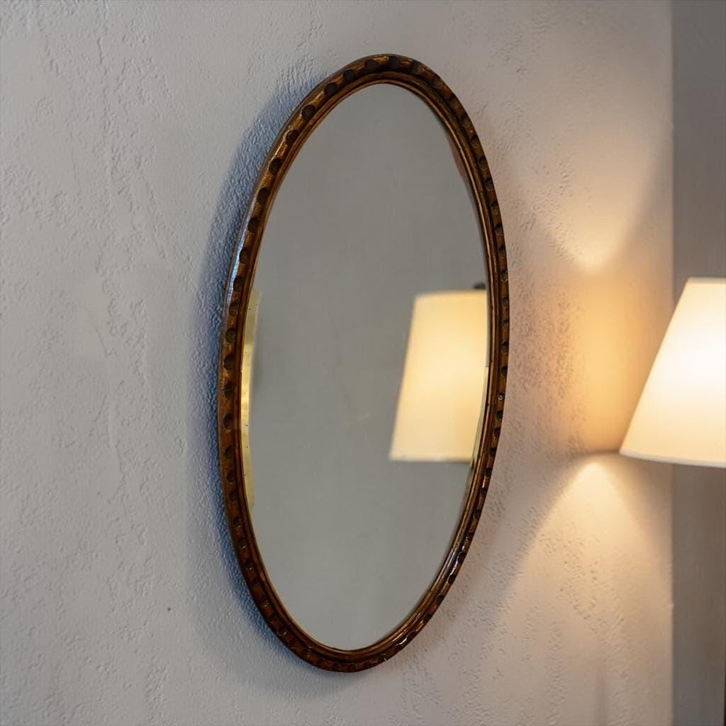 Robust vintage oval wall mirror in wood