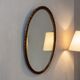 Robust vintage oval wall mirror in wood
