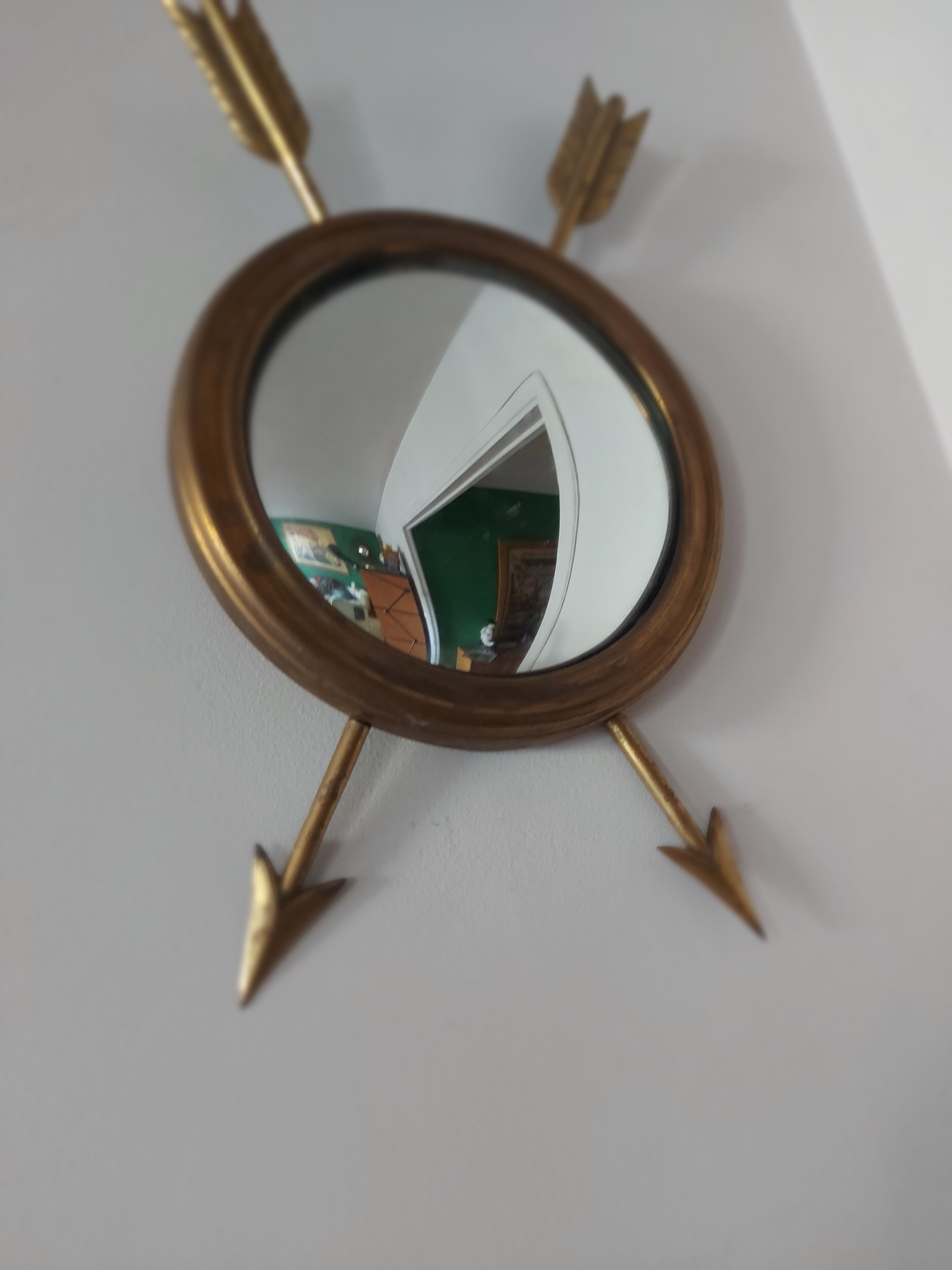 Curved brass witch's mirror