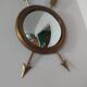 Curved brass witch's mirror