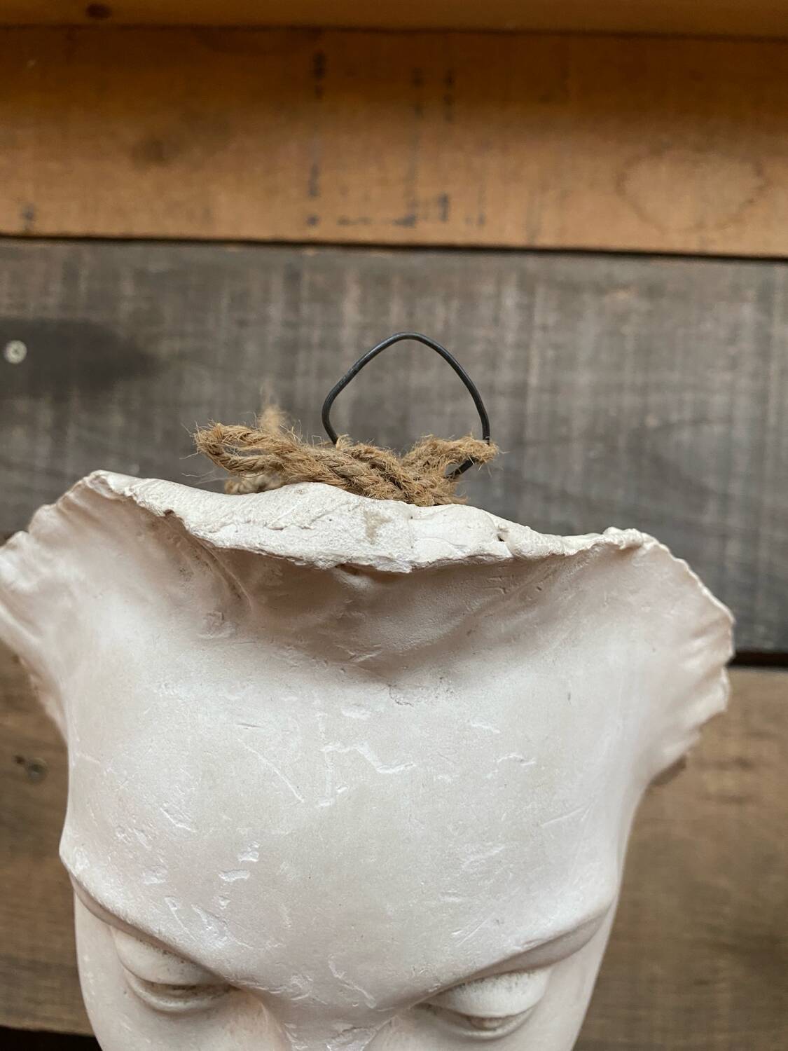 Plaster face wall statue