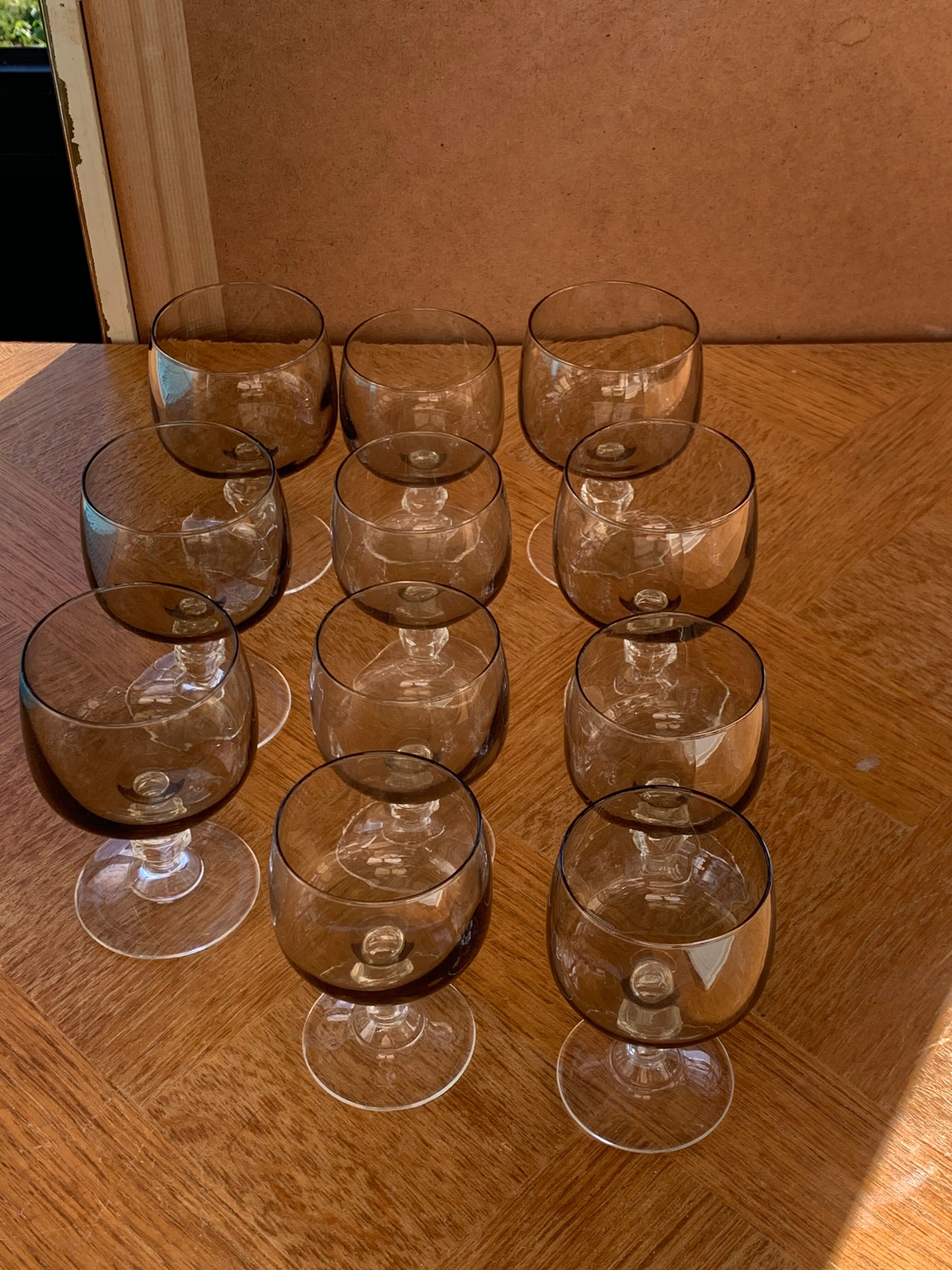 11 wine and water glasses in smoked grey glass and transparent base vintage 1970