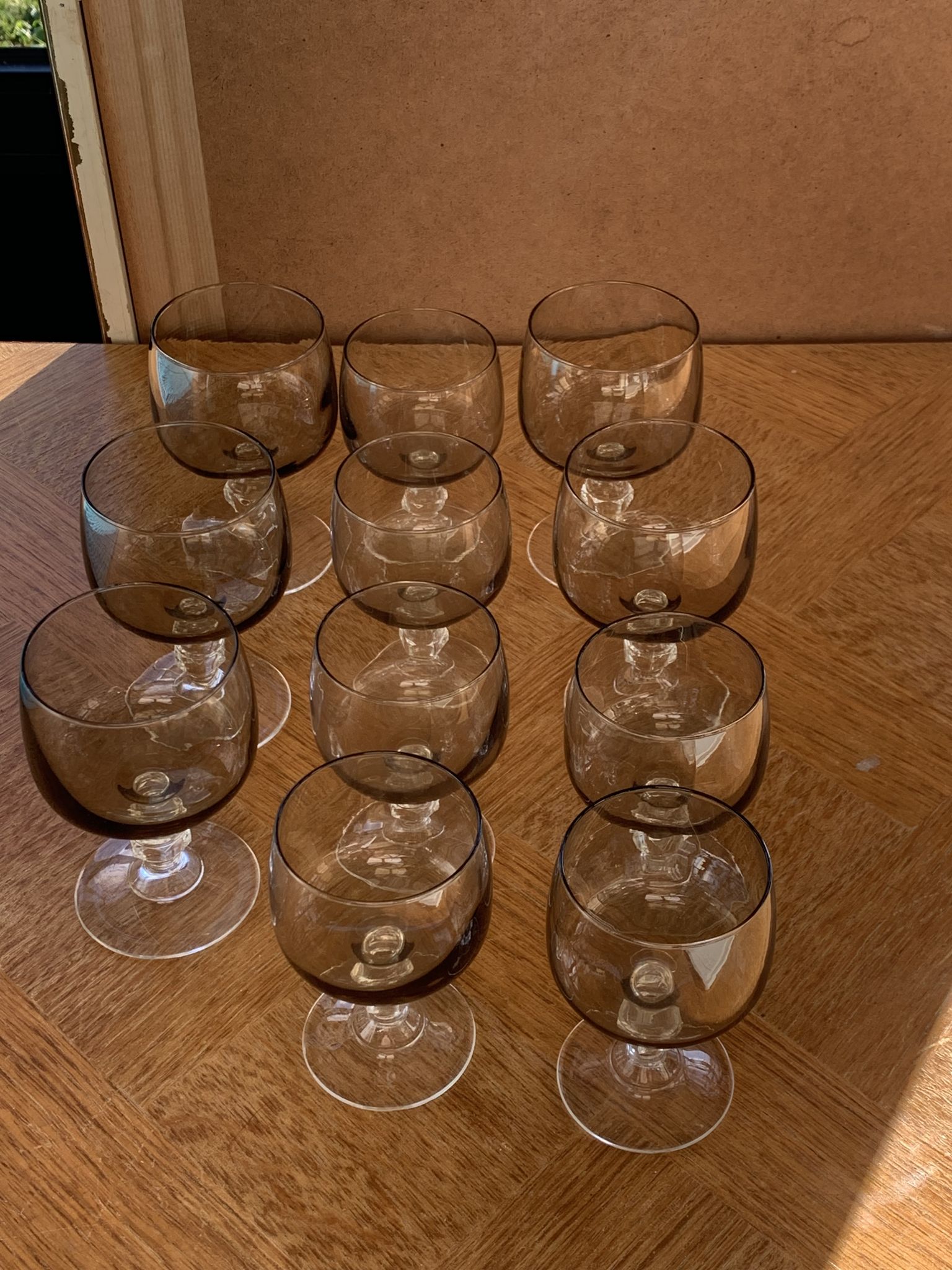 11 wine and water glasses in smoked grey glass and transparent base vintage 1970