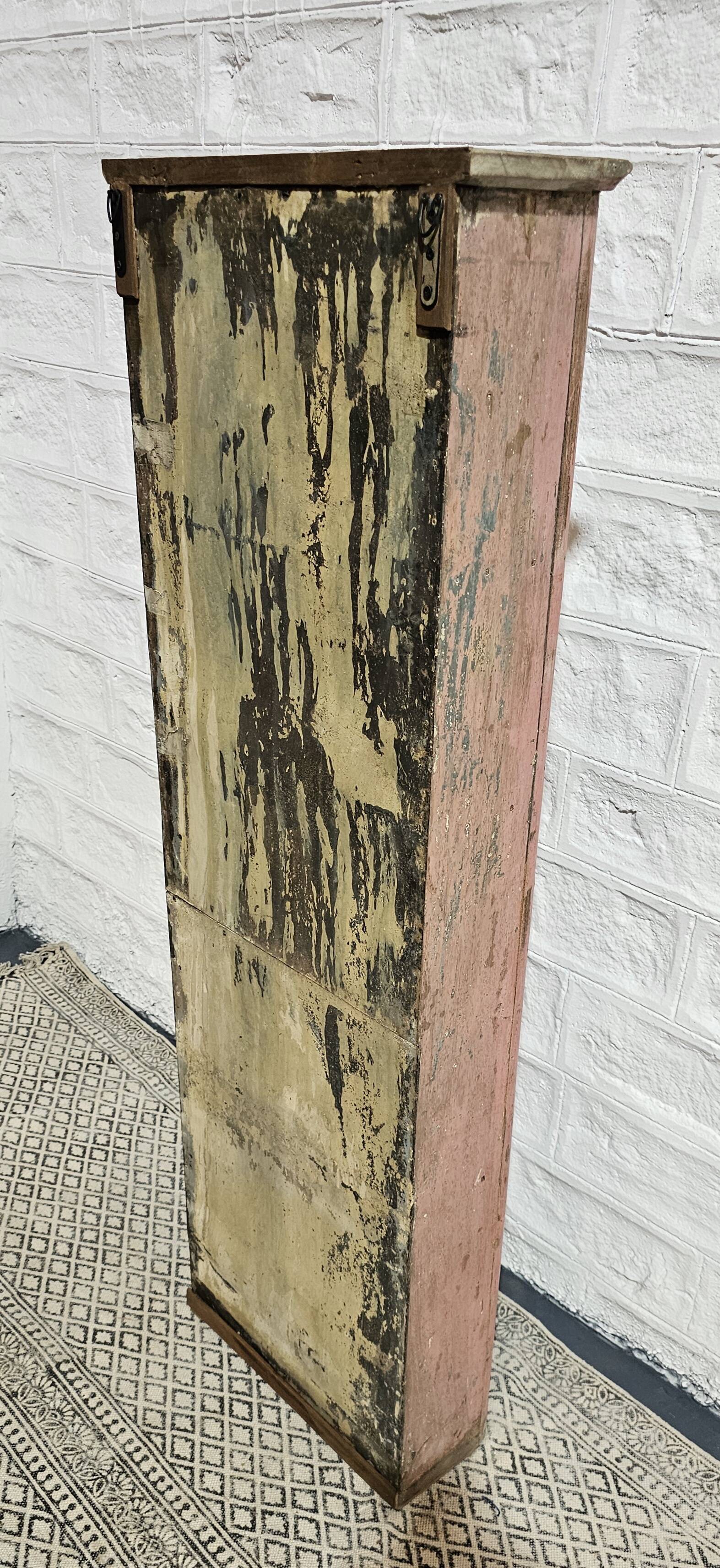 Pink showcase in Burmese teak